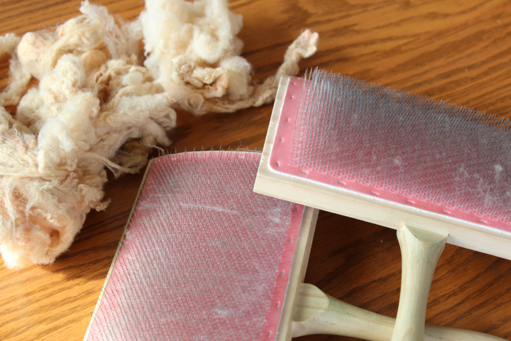 Hand carders and raw wool